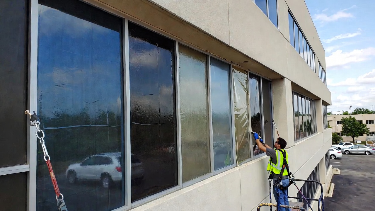Commercial window tinting installation in a Kansas City office building by A1 Window Tinting